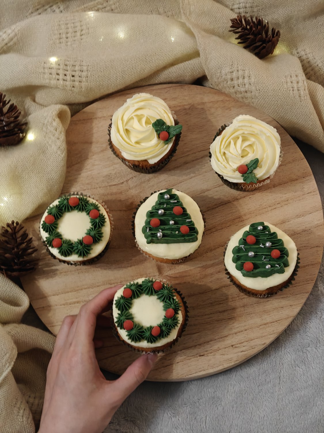 Christmas cupcakes with fondant wreaths and holly leaves